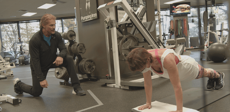 Jeff coaching a client through a plank